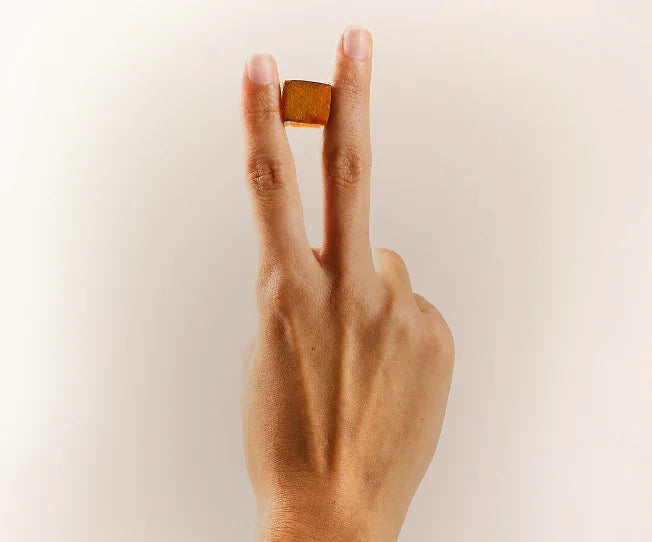 Tempo gummy held gently between two fingers